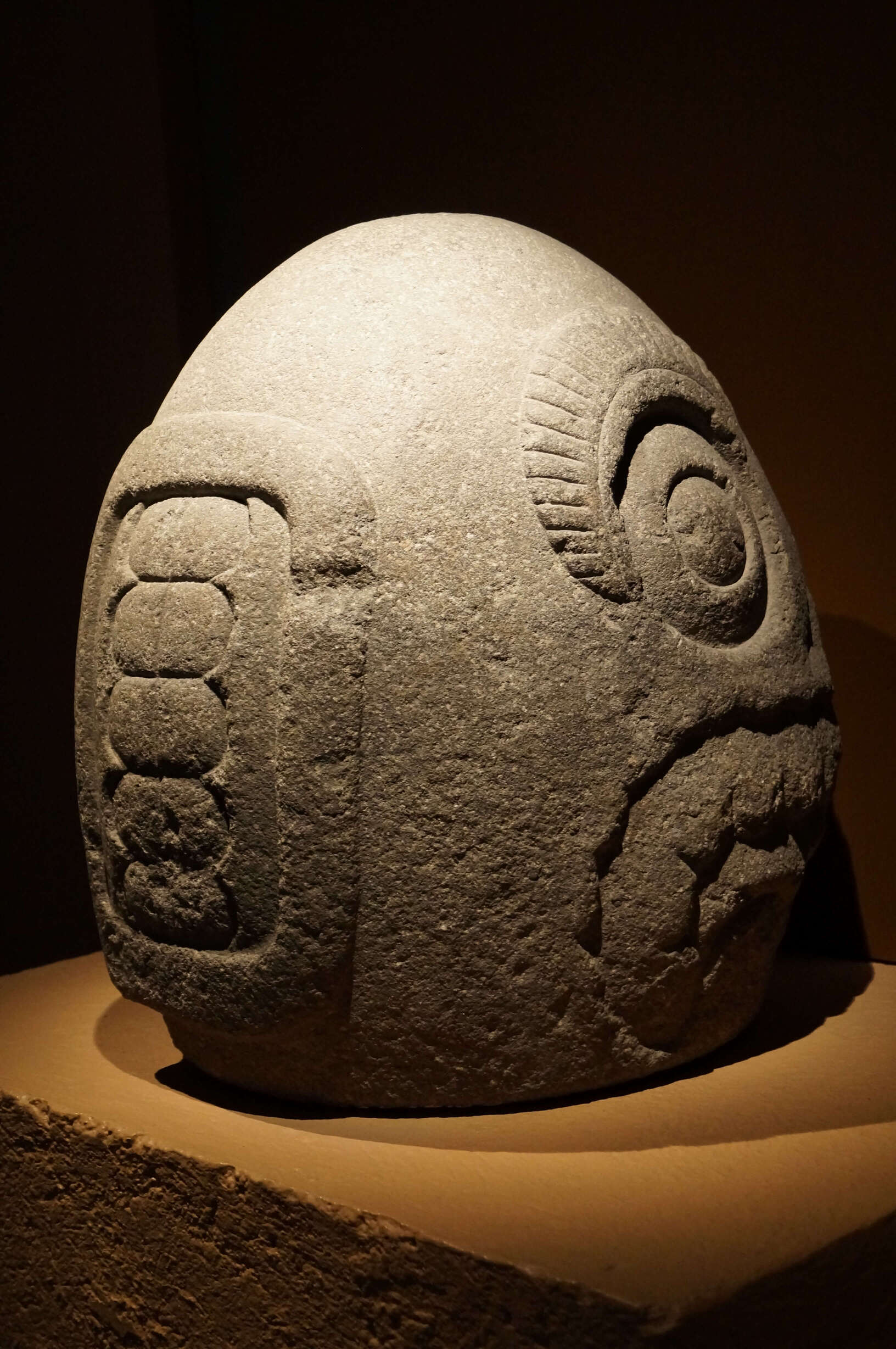 Stone carved aztec god face